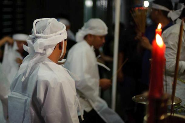 Vietnamese mourners in white. (going slowly)