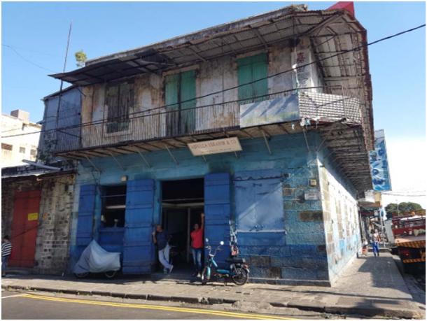 Wholesale store of Mr Abdullah Ibrahim, built of hand-cut volcanic stone, with the wooden residential first floor, called a Godam. (Image: Courtesy of the author)