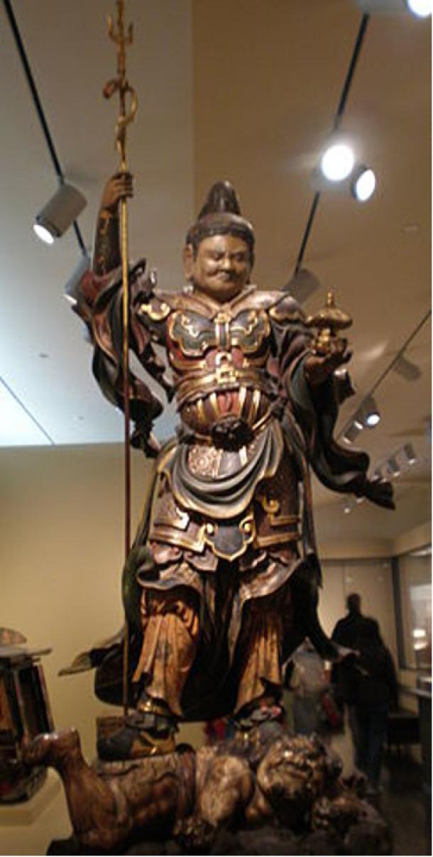 Wooden statue of Bishamonten stepping on a demon (1615-1700) on display at the Asian Art Museum in San Francisco, California.