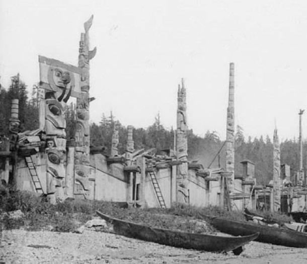 Wooden totem poles at the Skidegate Indian Village of the Haida tribe. Skidegate Inlet, British Columbia, Canada, 1878. (Public Domain)
