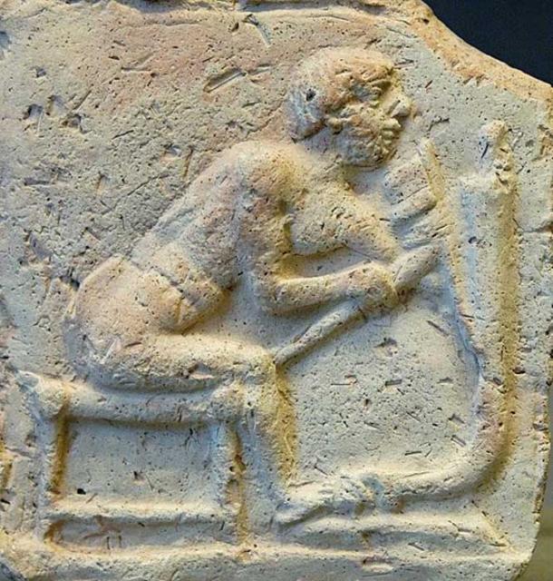 Worker using an adze for cutting a piece of a chariot. Terracotta relief, early 2nd millennium BC. From Eshnunna. (Marie-Lan Nguyen/CC BY SA 2.5)
