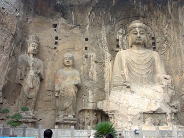 Wu Zetian made Buddhism the official religion. The Fengxian cave of the Longmen Grottoes was commissioned by Wu Zetian; the large, central Buddha is representative of the Vairocana. (G41rn8 / CC BY-SA 4.0)