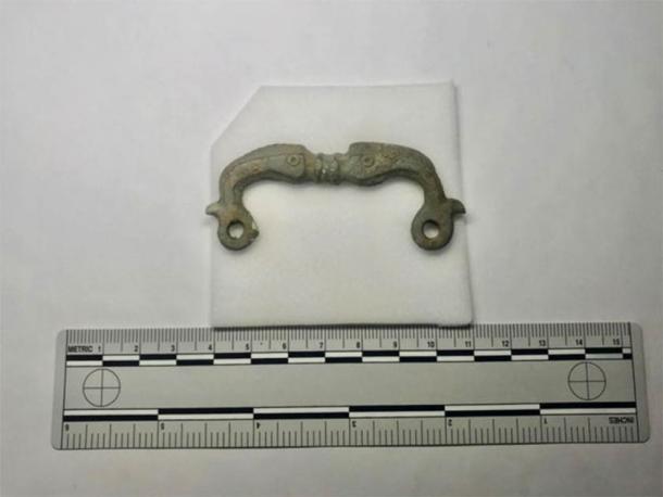 Zoomorphic buckle depicting flanking dolphins. (Oxford Archaeology East)