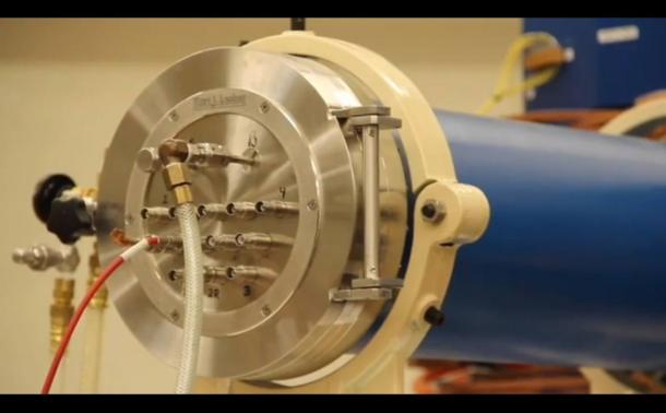 Screenshot of YouTube video showing scientists discussing their accelerator mass spectrometer that is dating layers of earth around fossils and tools in Sterkfontein Caves in South Africa.