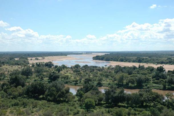 Taken from South Africa, to the left is Botswana and Zimbabwe is on the right. The river running from left to right is the Limpopo River. The river which disappears on the horizon is the Shashe.