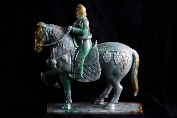 An ancient Chinese jade carving of a mounted warrior horseback riding in China. (bbbar / Adobe Stock)