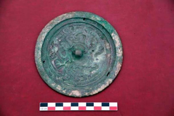 This ancient mirror was also found in the discovery. (Artur Kharinsky/The Siberian Times)