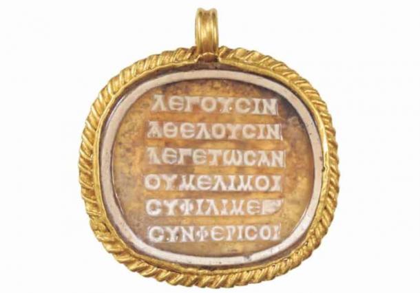 The ancient Greek 'stressed' poem inscribed on a cameo on a medallion of glass paste (2nd to 3rd century AD). (BHM Aquincum Museum and Archaeological Park / Péter Komjáthy /Cambridge Classical Journal)