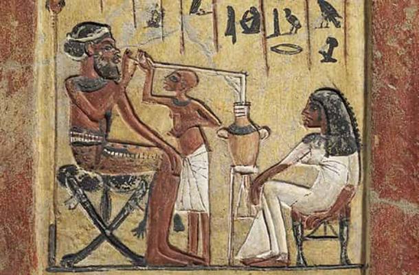 This image shows ancient Egyptian beer being consumed via a long tube. (Historical Eve)