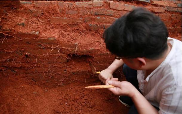 An archaeologist works at the excavation site of the ancient Chinese couple’s tomb dating back to the Northern Song Dynasty (960-1127) in Nanfentang Village, Batang Township, Ningxiang City, central China's Hunan Province, May 17, 2020. (Xinhua / Liu Jing)