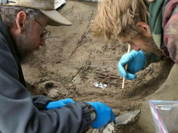 Ben Potter and colleague Joshua Reuther excavate the burial of two infants at Upward Sun River in Alaska