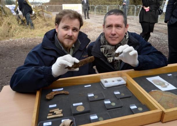 Archaeologists Kevin Mooney and Warren Bailie with some of the artifacts.