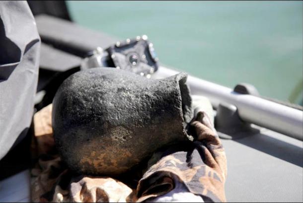 Dozens of artifacts were raised from the lake, which was located on the ancient Old Silk Road.