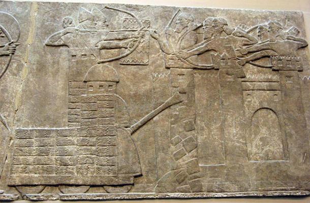 Assyrian attack on a town with archers and a wheeled battering ram. Neo-Assyrian relief, North-West Palace of Nimrud, 865–860 BC. (Public Domain)