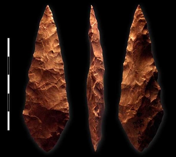 Example of bifacial silcrete point from M1 phase (71,000 BC) layer of Blombos Cave, South Africa; scale bar = 5 cm.