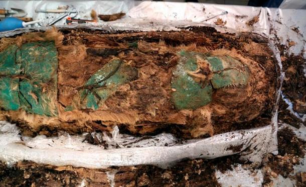 'The body was covered with copper or bronze plates on the face, chest, abdomen, groin - and bonded with leather cords.'