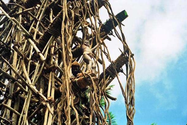 A boy contestant at the top of the rickety tower about to jump during the land diving ceremony on the Pentecost Island, Vanuatu. (Paul Stein / CC BY-SA 2.0)