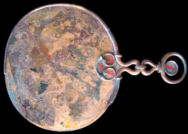 The bronze mirror found in the central Birdlip grave. 