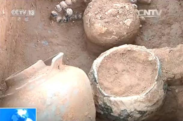 There are two rings on each bronze pot, and they were used to hang up the pots for cooking. 