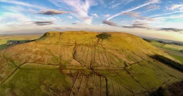 Burnswark hillfort in southwest Scotland was used as the start point for discovering the indigenous Hadrian’s Wall settlements, which lay north of Hadrian’s Wall that was pretty much the northernmost frontier of the Roman Empire.     Source: J. Reid /  Antiquity Publications Ltd