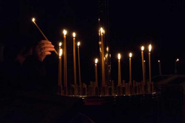 People lighting candles on All Saints’ Day. Reuters/Philippe Wojazer