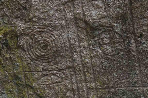 Detail of the carving with object identified as an umbrella (Public Domain)