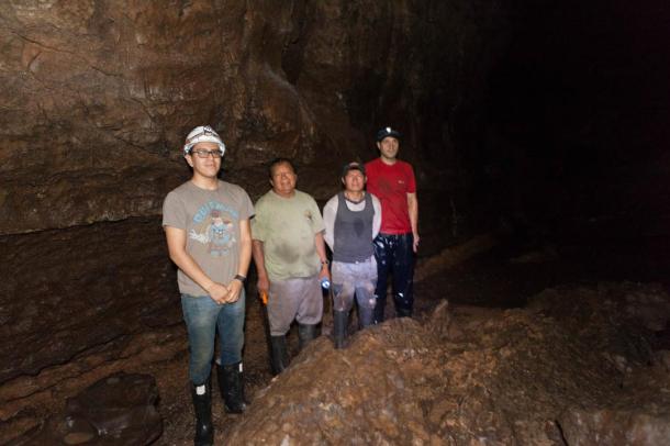 Exploring the cave on the 4th day, Chris and Gary with two of the guides.