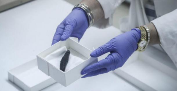 The charred scroll containing Biblical text.