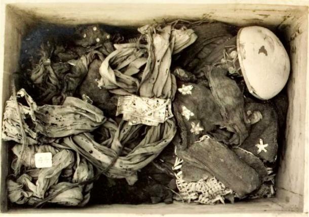 The contents of one of the storage trunks in Tutankhamun’s tombs, containing linen garments and loin cloths. (Public Domain)