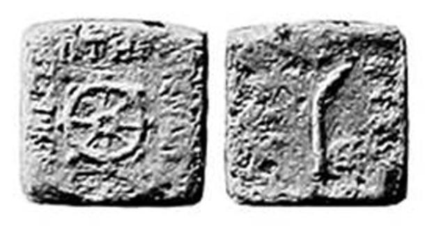 A coin of Menander I (r.160–135 BC) with a dharmacakra and a palm. (Public domain)