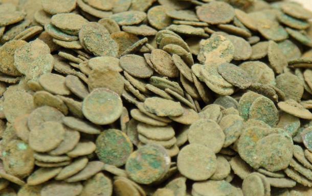 A photo of the coins before they were cleaned