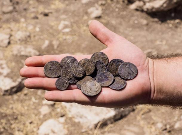 The cache of silver coins found at the estate house.