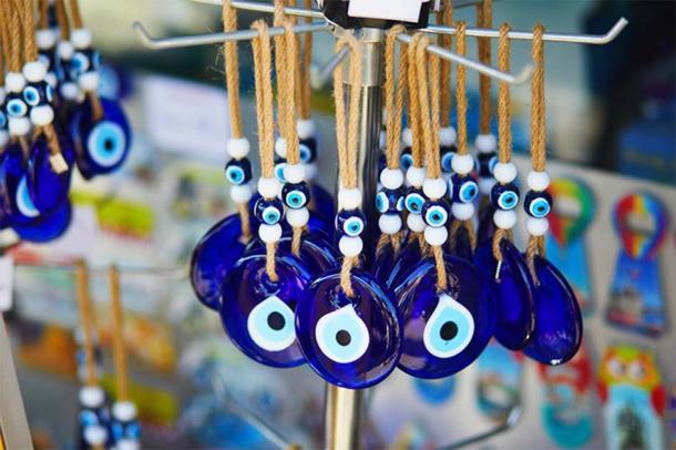 A collection of Nazar amulets on display in Turkey, used to protect against the evil eye. (Ekaterina Pokrovsky / Adobe Stock)