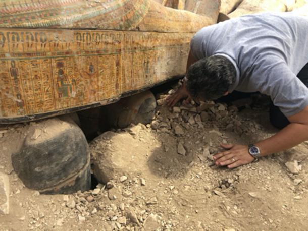 Minister of Antiquities Khaled el-Anany looking at recently discovered ancient colored coffins. (Ministry of Antiquities)