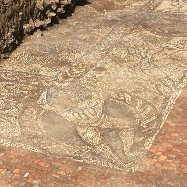 The corner of the mosaic seems to have an image of Atlas supporting the inner frame