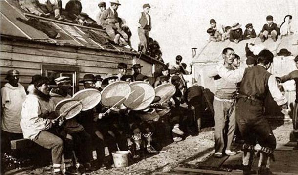 Iñupiat dance near Nome, Alaska, 1900 in which offerings are made to the fart god.