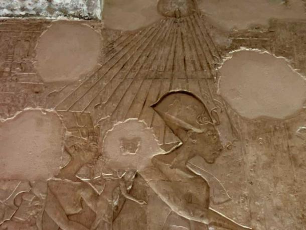 A depiction of Akhenaten, Nefertiti, and their young daughters, from the Tomb of Aye, #25, Amarna, Egypt. Do you notice the ankh sign for “life” being bestowed on the king’s nostrils by the loving hands of the Aten sun disk? An embrace of life (as the king understood it), as opposed to the usual Egyptian focus on death, was the new guiding principle at Amarna. (© Jonathon A. Perrin)