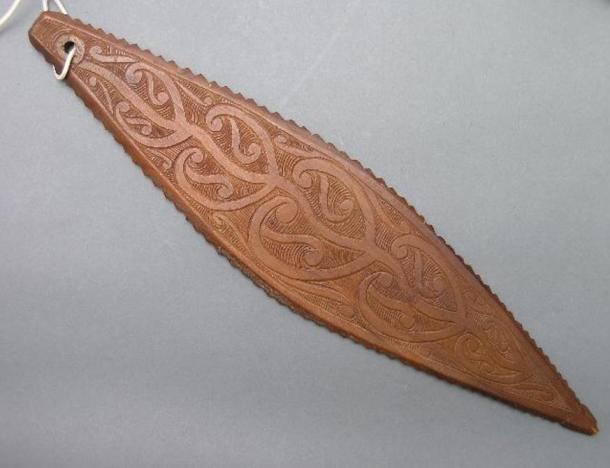 A detailed purerehua (bullroarer) created in the early 1900s.