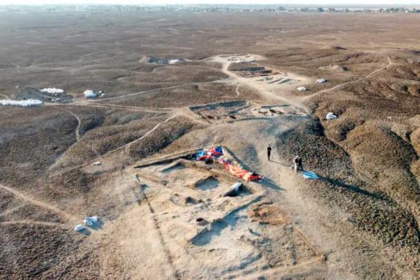 A drone photo of the trenches excavated in fall 2022, the most recent fieldwork season. The closest trench shows the tavern with a type of clay refrigerator called a “zeer,” an oven, and benches. (Lagash Archaeological Project)