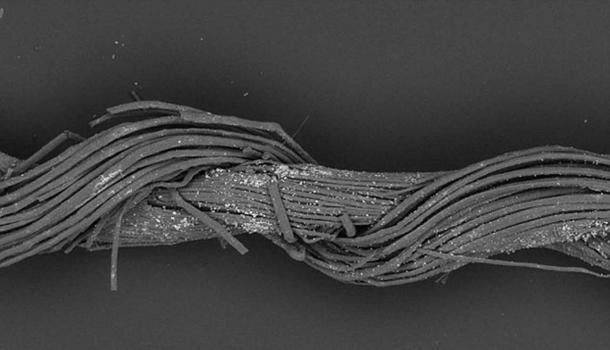 A splice in one of the single thread elements of fabric found in the cave of a warrior, Israel Credit: M. Gleba, S. Harris, with permission of Israel Antiquities Authority