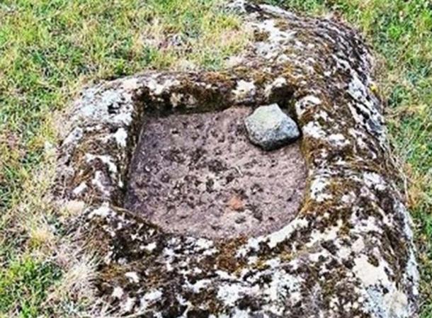 An example of basins found near rocks that look like human faces or animals on the Azores islands.
