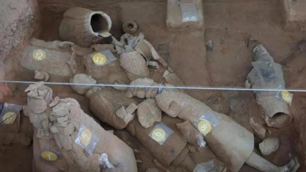 A few of the 25 Terracotta Army soldiers, many in pieces, recently uncovered in Xian, China. (China News)