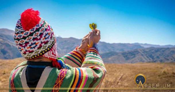 Performing an offering ceremony to Pachamama in the Andes region of Peru. Source: Yuri - Supay / Adobe Stock