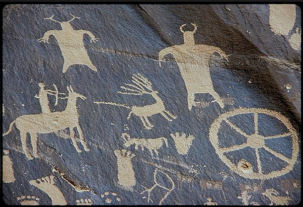 A petroglyph from Newspaper Rock, Utah, showing hunting with a bow and arrow.