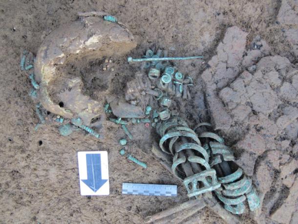 The striking remains of the woman buried with 19 bronze bracelets and 8 rings on her hands