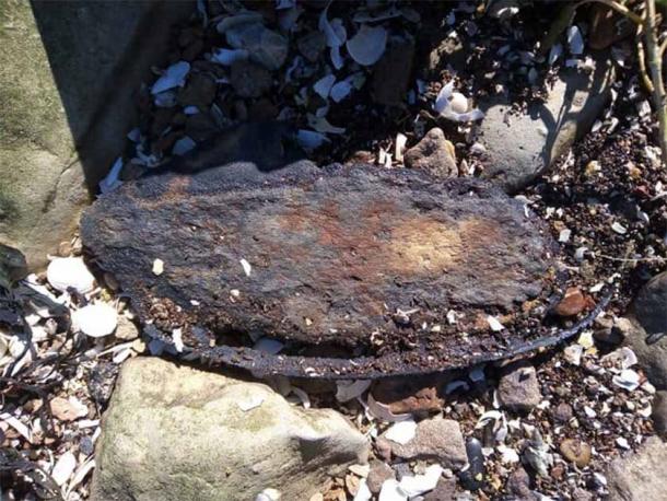 The Bronze Age shoe, in situ where it was found on the river edge in Kent, England. Source: Steve Tomlinson