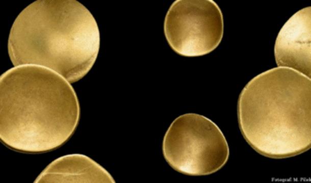 A sampling of the 41 curved Celtic golden coins from the late Iron Age found not far from present-day Berlin, Germany. Source: Brandenburg State Office for the Preservation of Monuments and Archaeological State Museum
