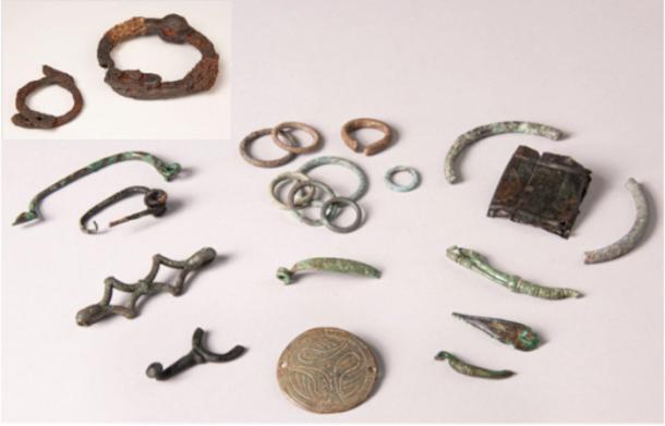 A set of small Gallic offerings and a pair of the Celtic iron shackles from Allonnes. 