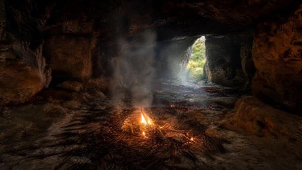 representations of Cloggs Cave Interior with grass burning on the cave floor.