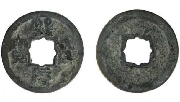 The worn cast copper alloy Chinese coin, from the Northern Song dynasty (960 AD to 1127 AD), minted during the Xining reign between 1068 and 1077 AD, and found in Britain